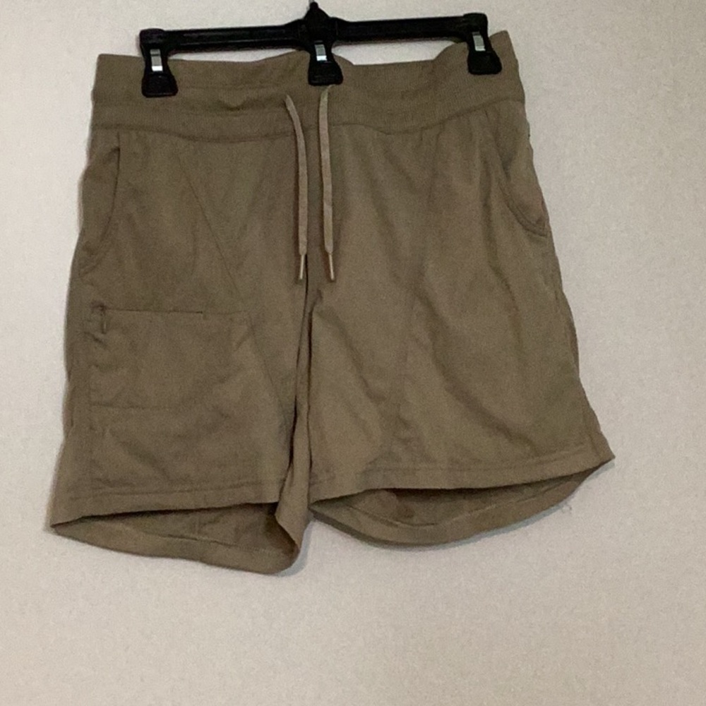 The North Face women’s athletic shorts, size medium, color tan, elastic waist